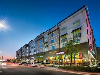 a large building with cars parked in front of it at The Rialto, Orlando, Florida